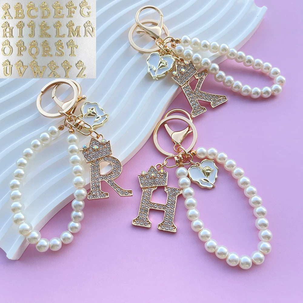 Faux-pearl keychain with a crystal crown initial letter