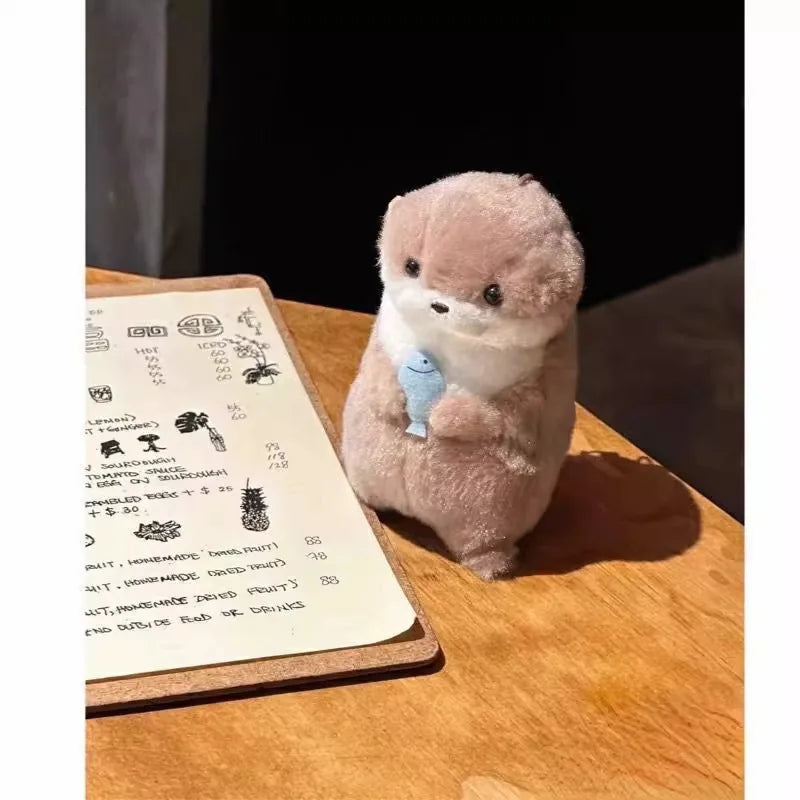 Otters Holding Fish Bag Charm