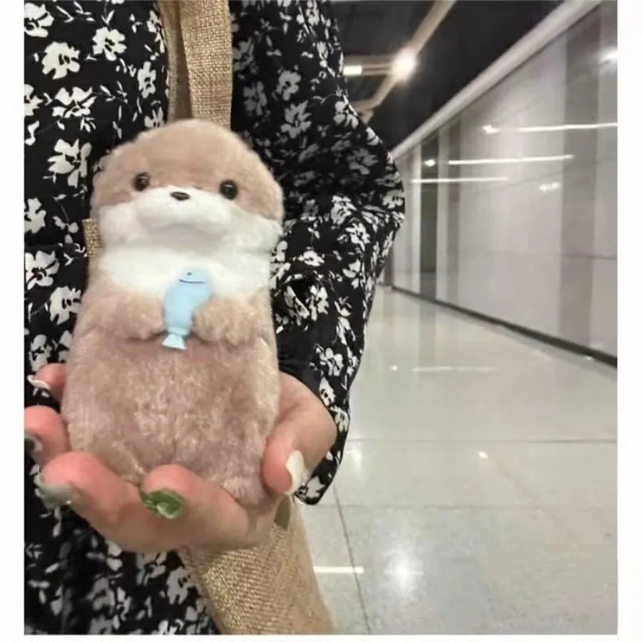 Otters Holding Fish Bag Charm
