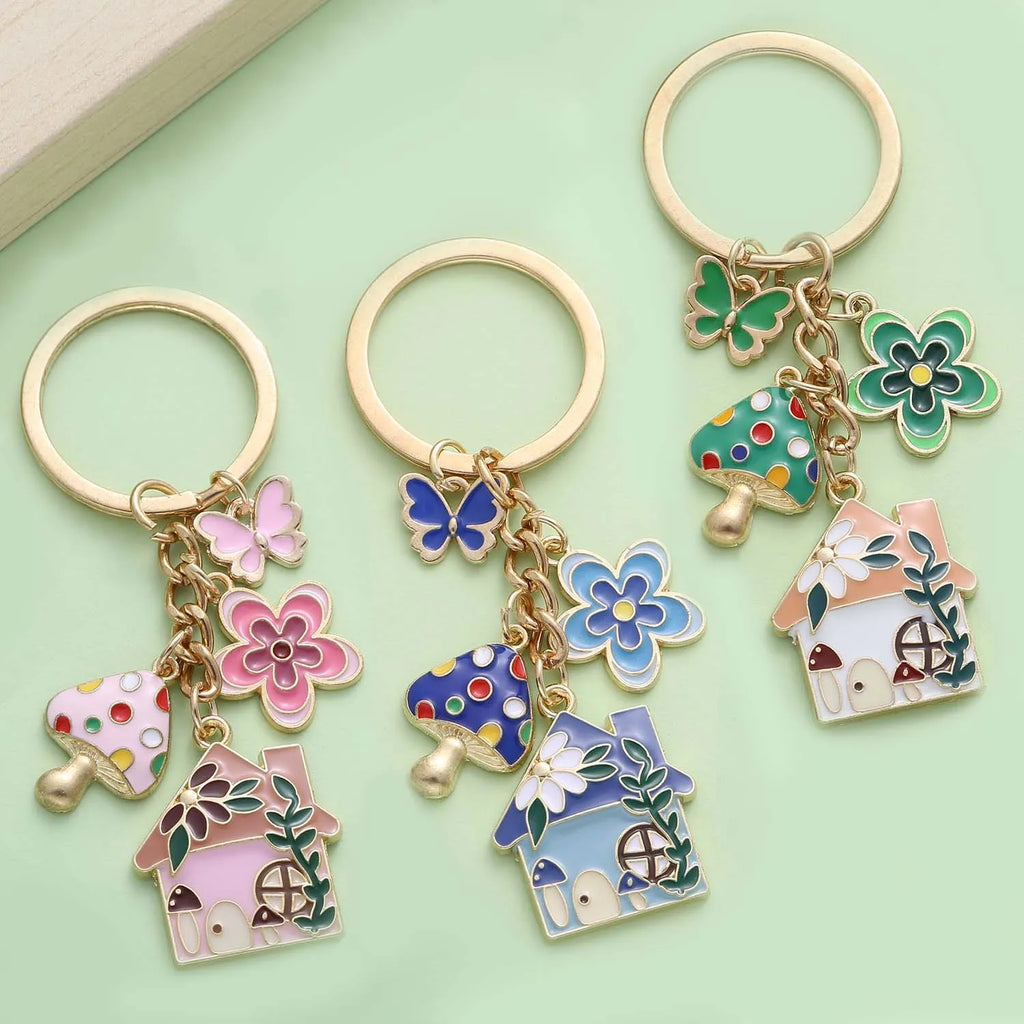 Enamel mushroom, flower and butterfly fairy tale keychain