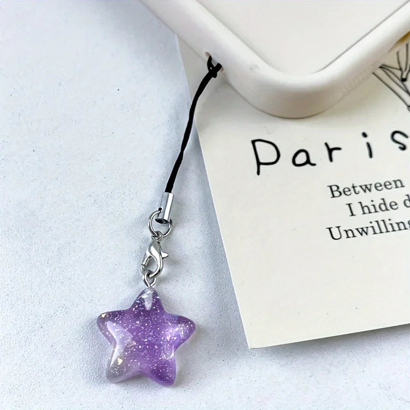 Glittery purple-blue star phone charm on a beaded strap