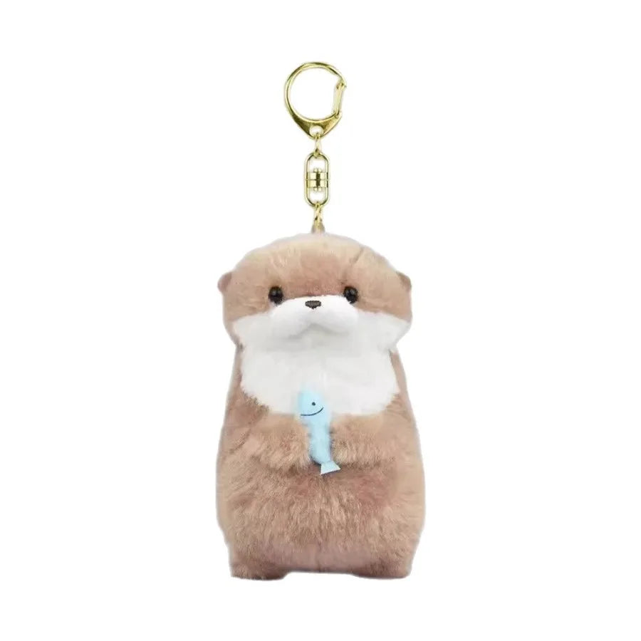 Plush otter holding a fish bag charm keychain