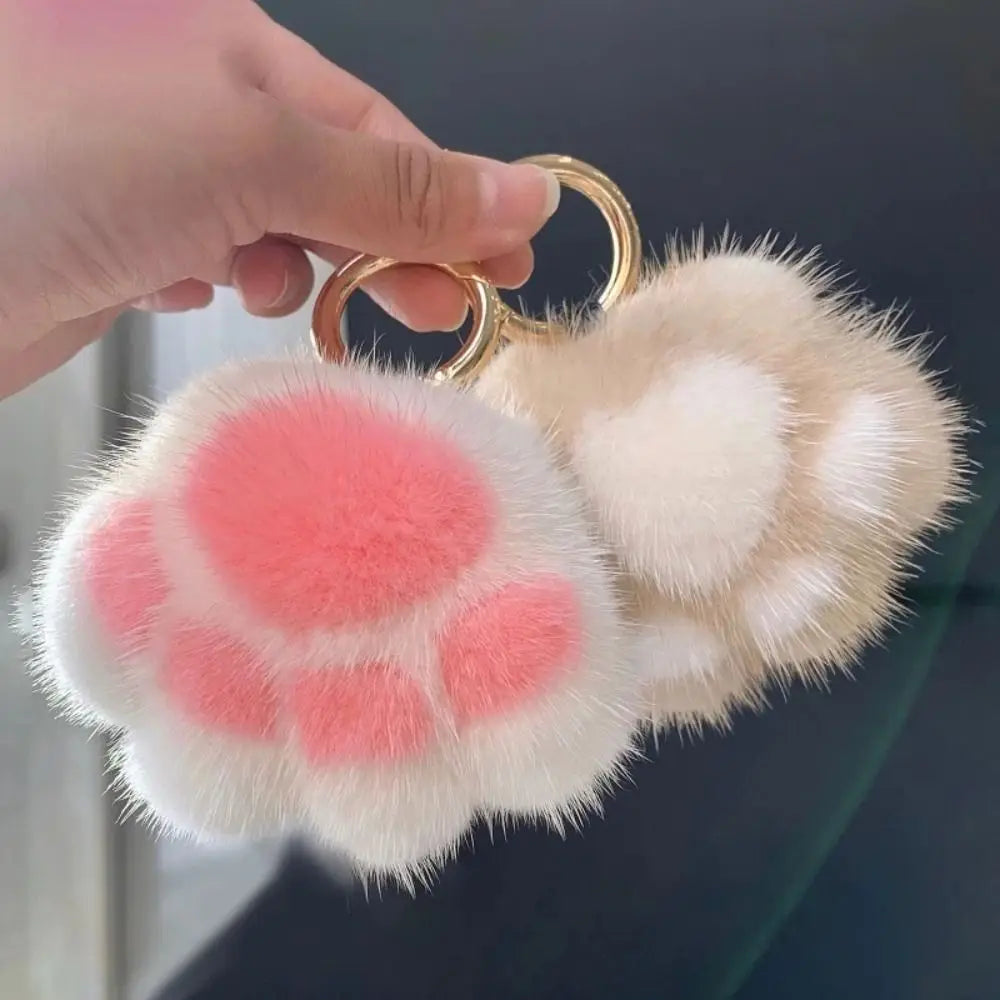 Fluffy faux-fur cat paw pompom keychain with pink toe beans