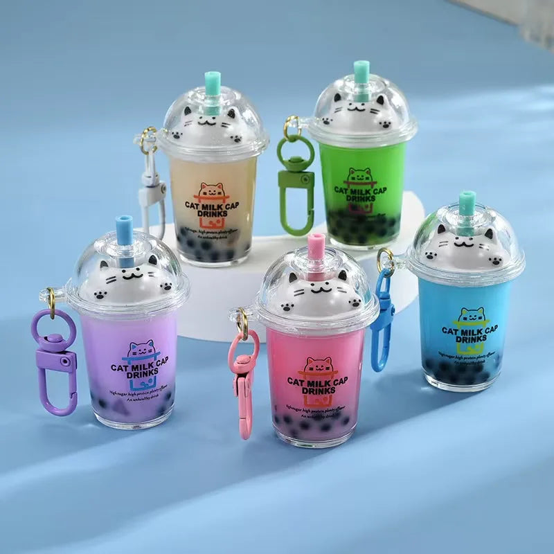 Liquid-filled cat boba milk tea keychain with glitter pearls
